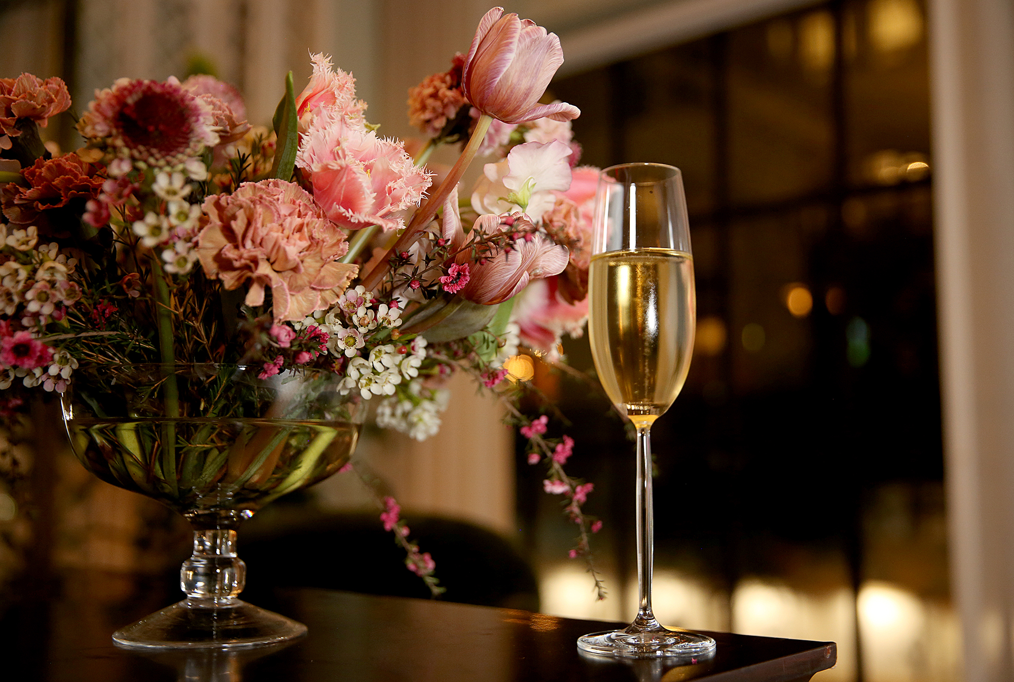Bouquet of flowers with glass of Sekt